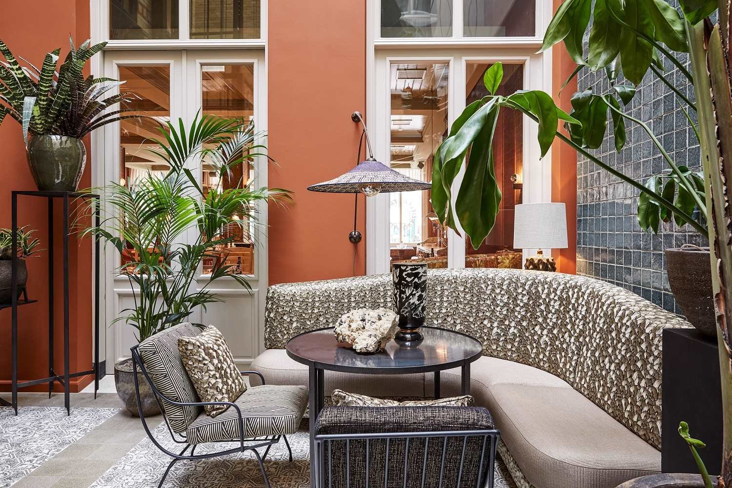 Cozy indoor lounge with plants and modern furniture